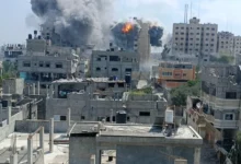 moke rises during an Israeli strike on a residential building