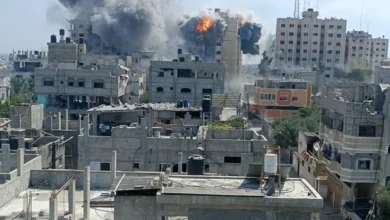 moke rises during an Israeli strike on a residential building